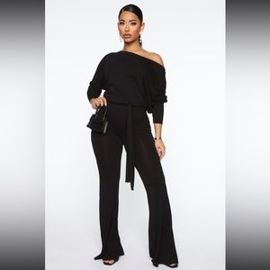 Fashion nova jumpsuit black size medium . Flair leg off shoulder Nwt